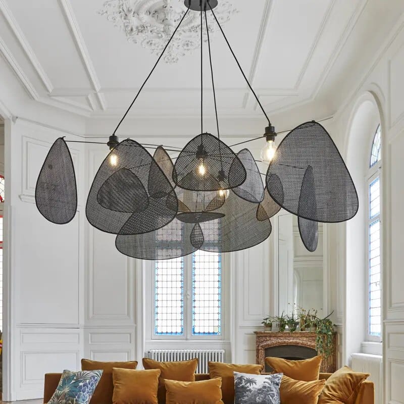 Matte black handwoven rattan pendant light – XXL variant, shown in a room setting