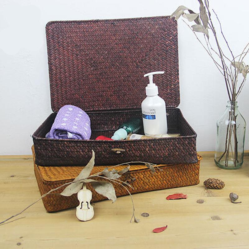 Low flat dark rattan storage trunk for under the bed – shown in a room setting