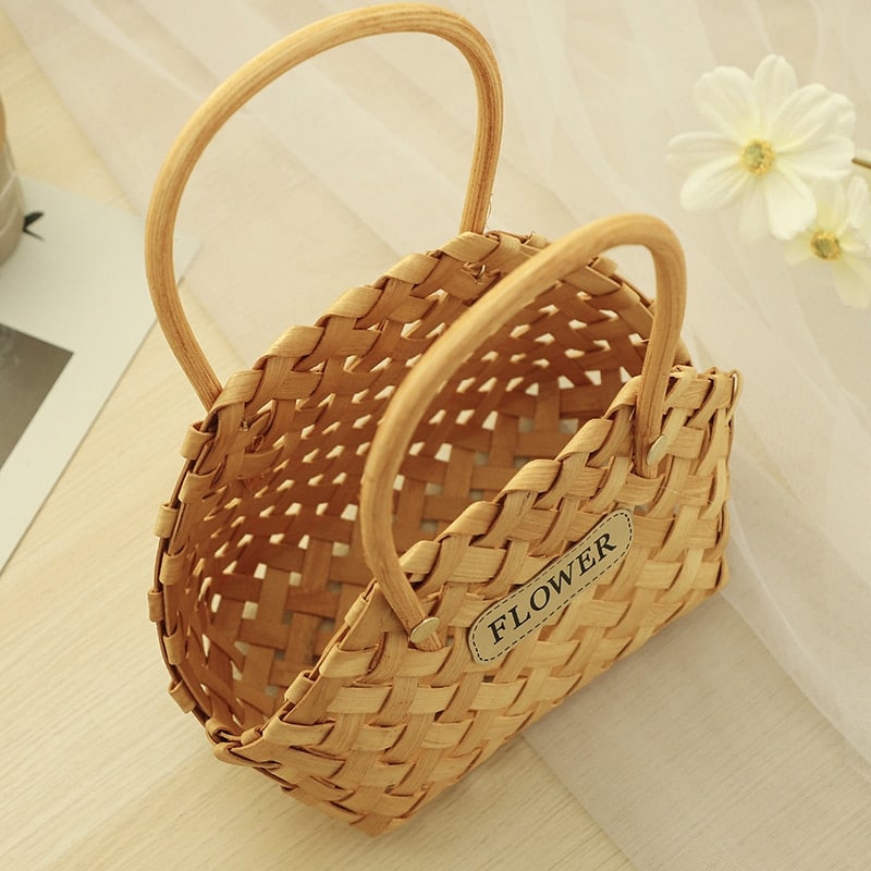 Mini woven flower basket with painted florals and white fabric lining – close-up detail