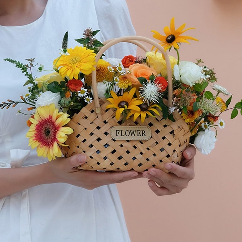 Mini woven flower basket with painted florals and white fabric lining – shown in use (2)