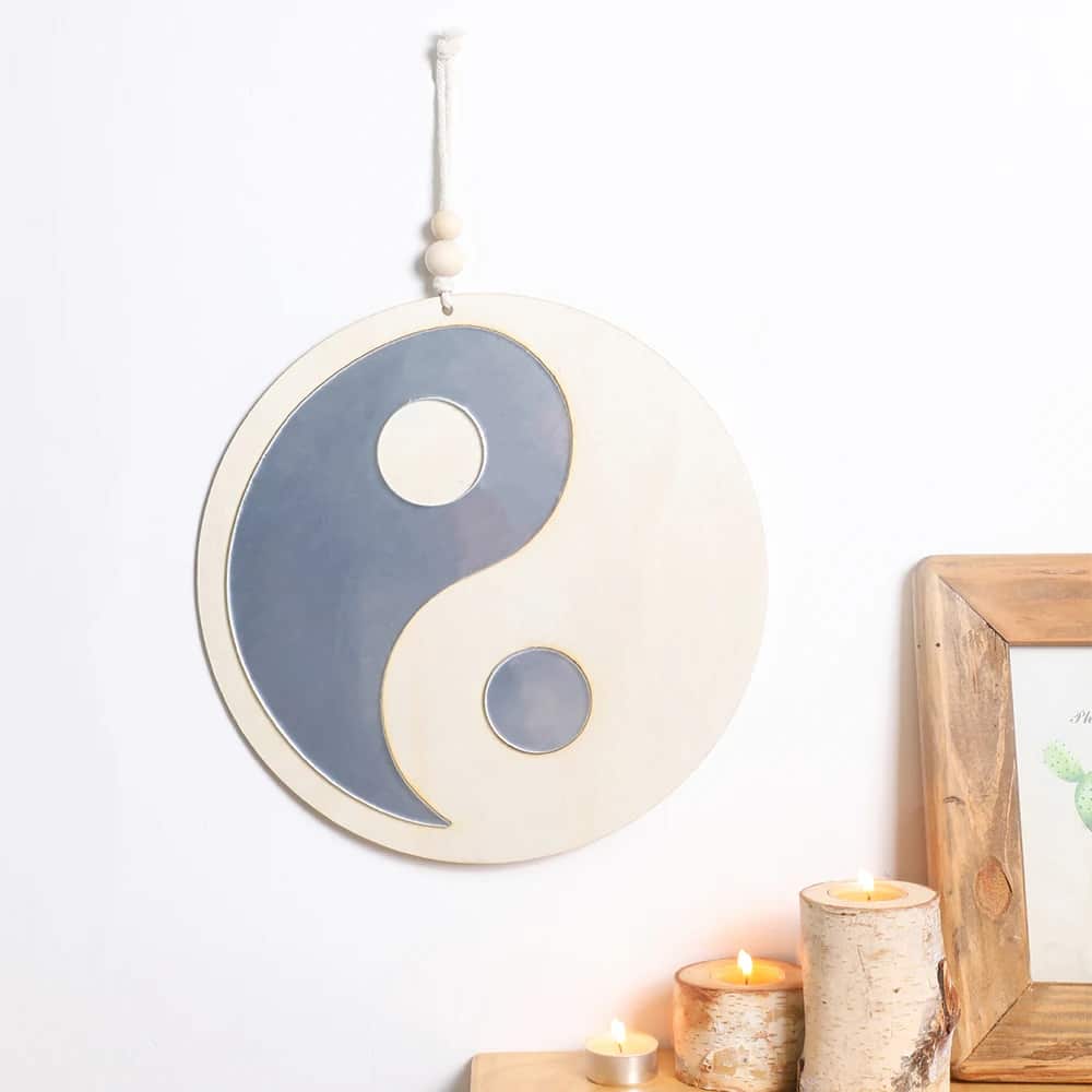 Wooden wall mirror in a yin and yang shape