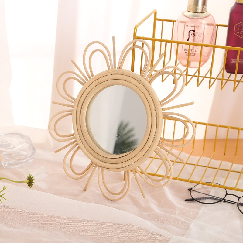 Double flower rattan mirror with layered petals – shown in a room setting