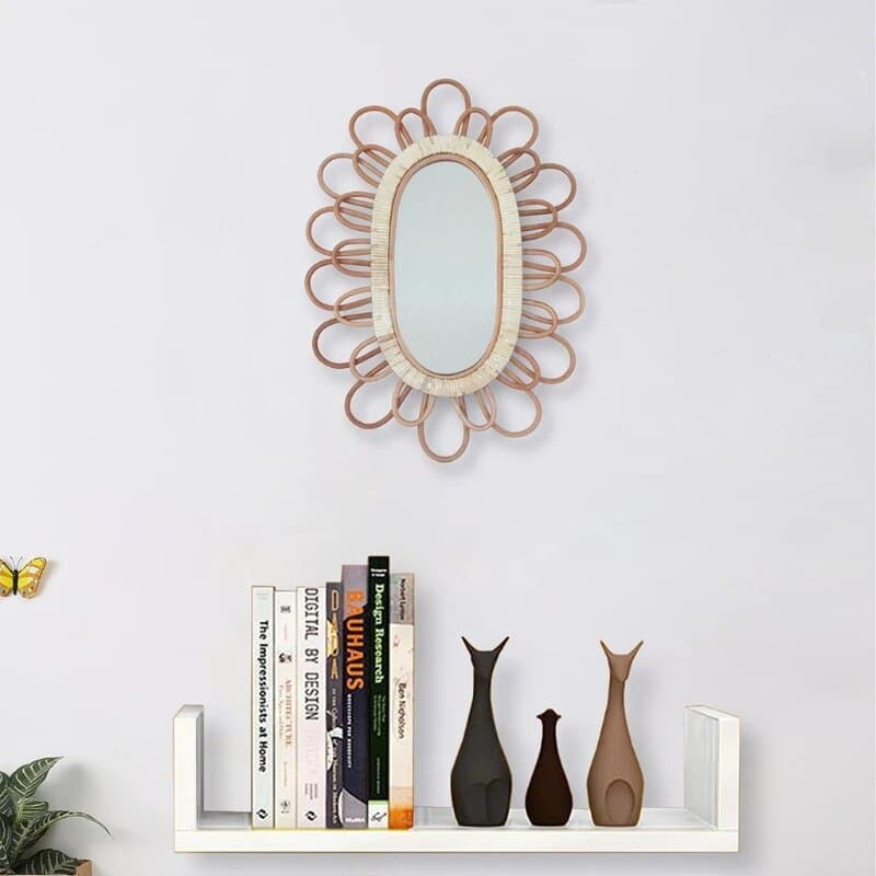 Oval rattan wall mirror with a hand-braided frame – shown in a room setting (2)