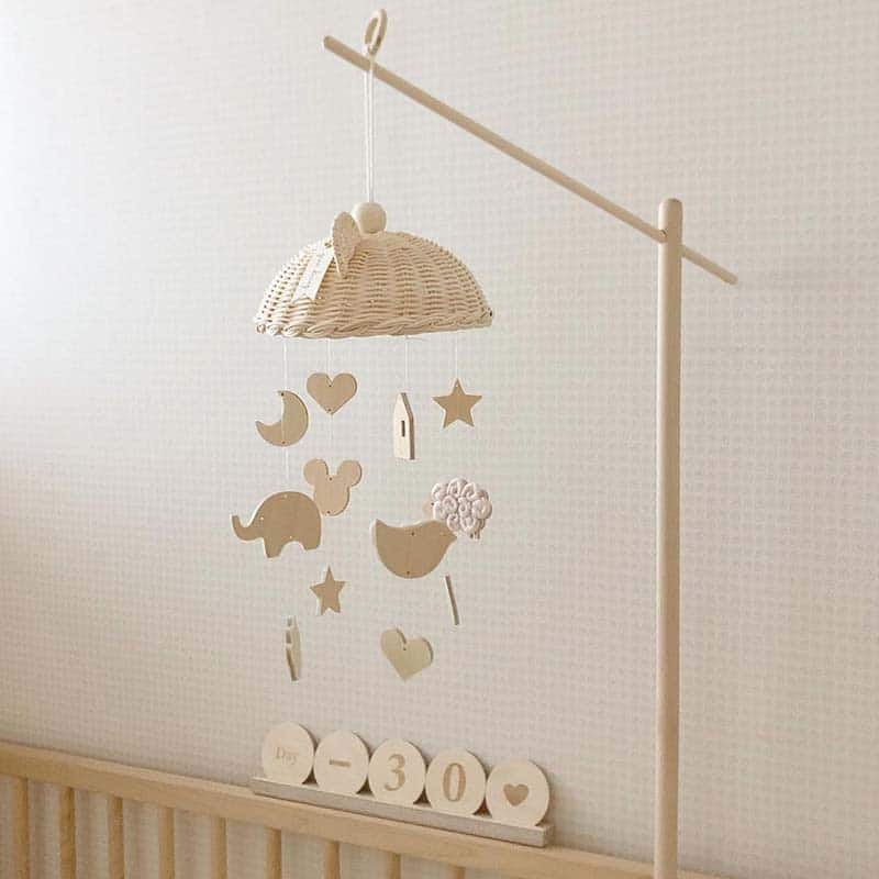 Rattan baby mobile with four hand-braided balls – shown in a room setting (2)