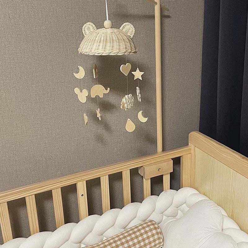 Rattan baby mobile with four hand-braided balls – shown in a room setting (3)
