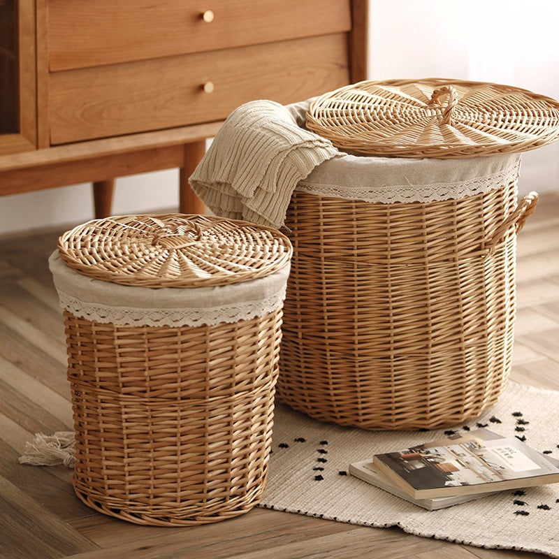 Hand-braided rattan laundry basket with a removable lid and handles – shown in a room setting (2)