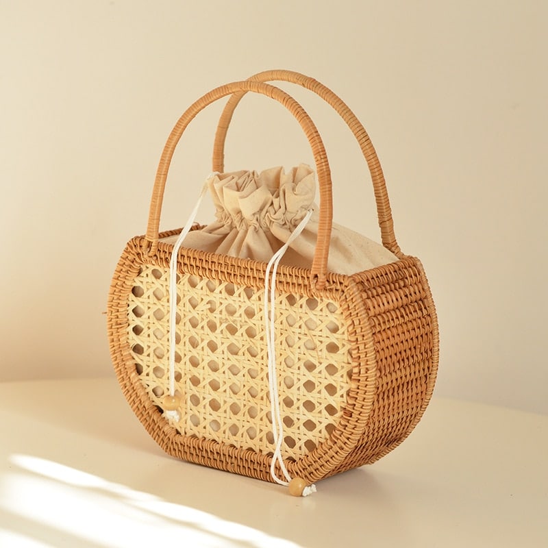 Vintage round rattan handbag with a rattan handle