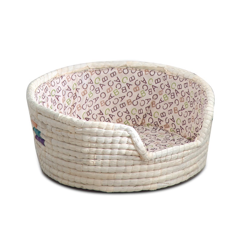 White handwoven rattan dog bed