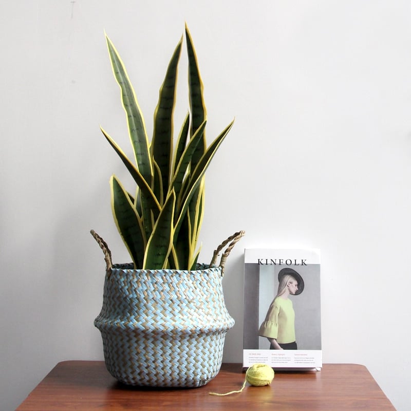 Boho striped foldable rattan storage basket – shown in a room setting (2)
