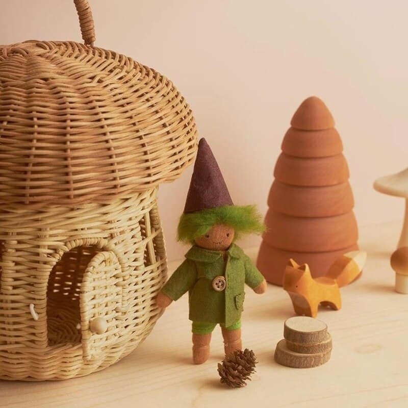 Handwoven rattan storage basket shaped like a little house – shown in a room setting (2)