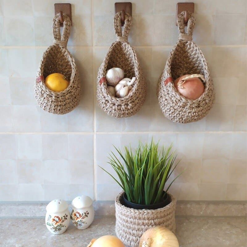 Wall-hanging woven fruit and vegetable basket with open walls – shown in a room setting (3)