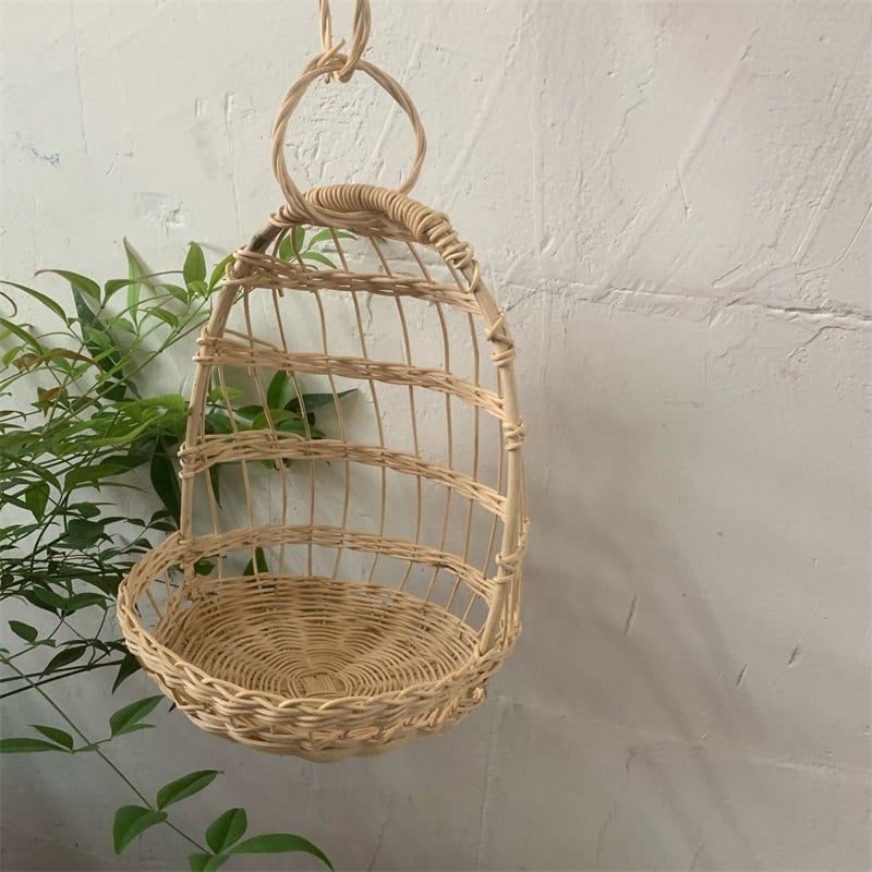 Nordic hanging rattan toy storage basket – shown in a room setting (2)
