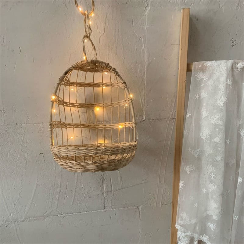 Nordic hanging rattan toy storage basket – shown in a room setting (3)