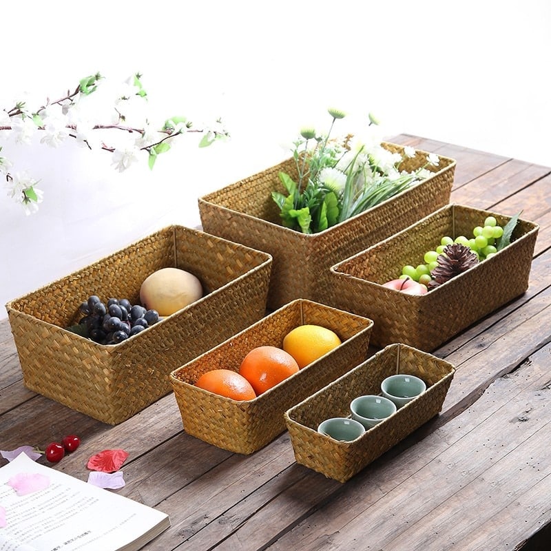 Rectangular handwoven rattan storage bin – shown in a room setting