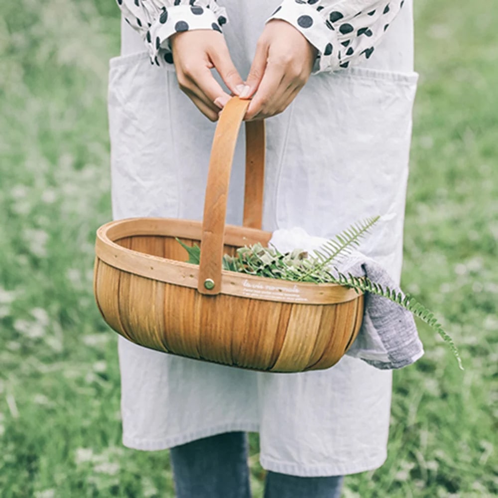 Beige round wicker-look fruit and vegetable basket – shown in use
