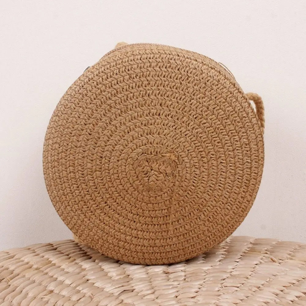 Round brown wicker-look crossbody basket bag