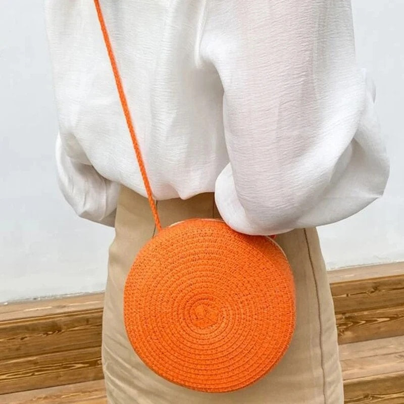 Round orange wicker-look shoulder basket bag – worn by a model (2)