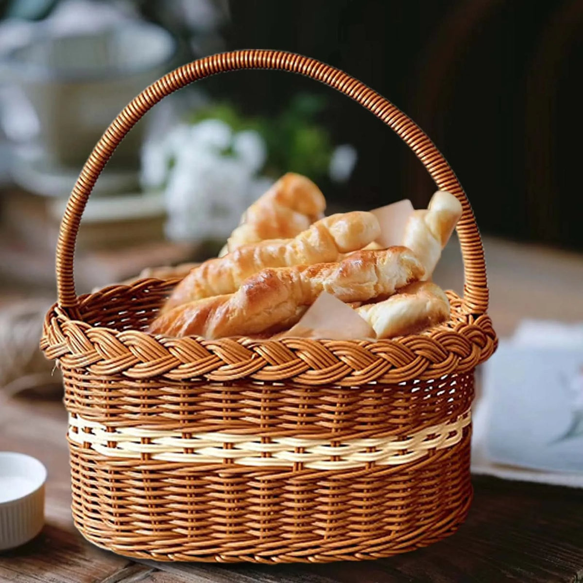 Wicker-look basket with a fine white trim along the rim – shown in a room setting