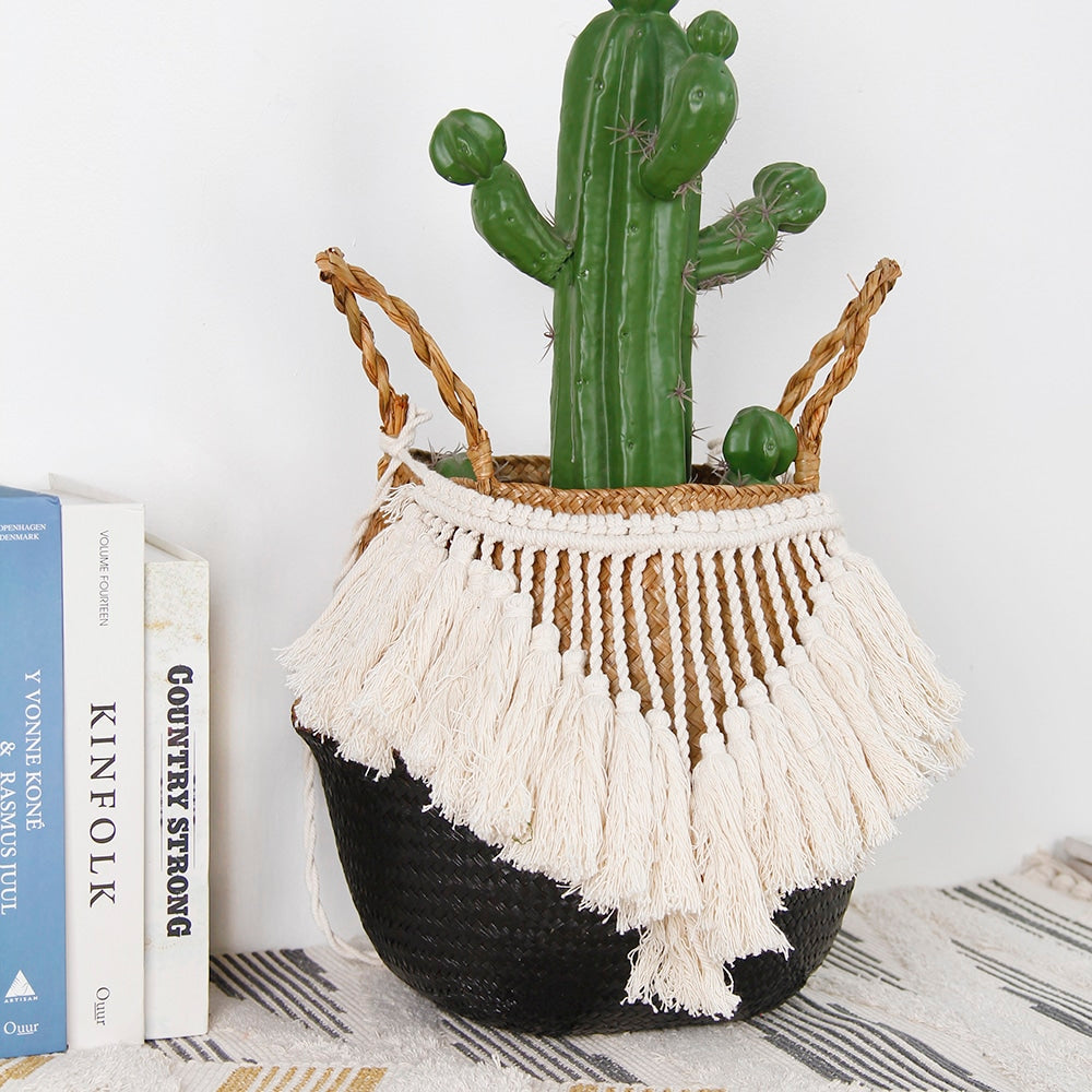 Black and beige wicker basket with a fringed border and white pompoms – shown in a room setting (4)