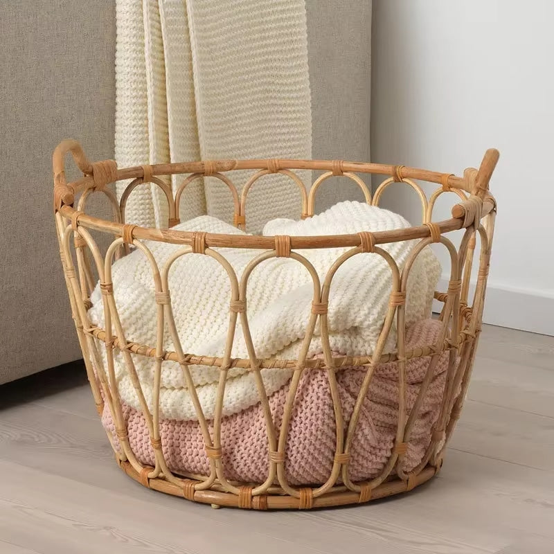 Open natural rattan laundry basket with an airy structure – shown in a room setting