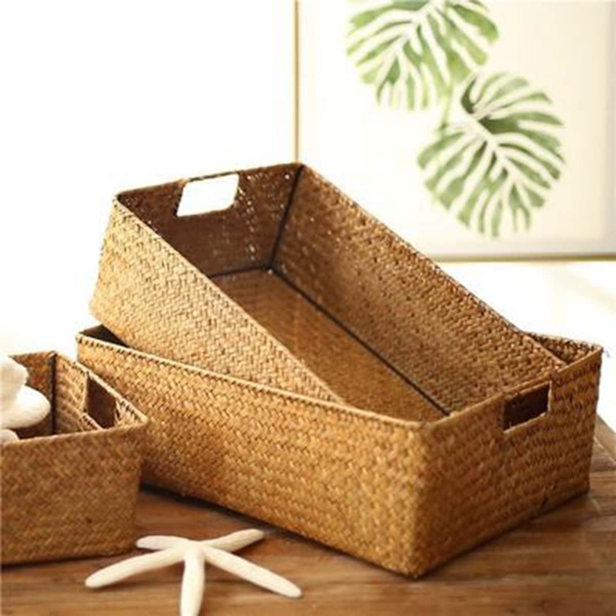Natural fiber woven storage basket with sturdy handles – shown in a room setting (2)