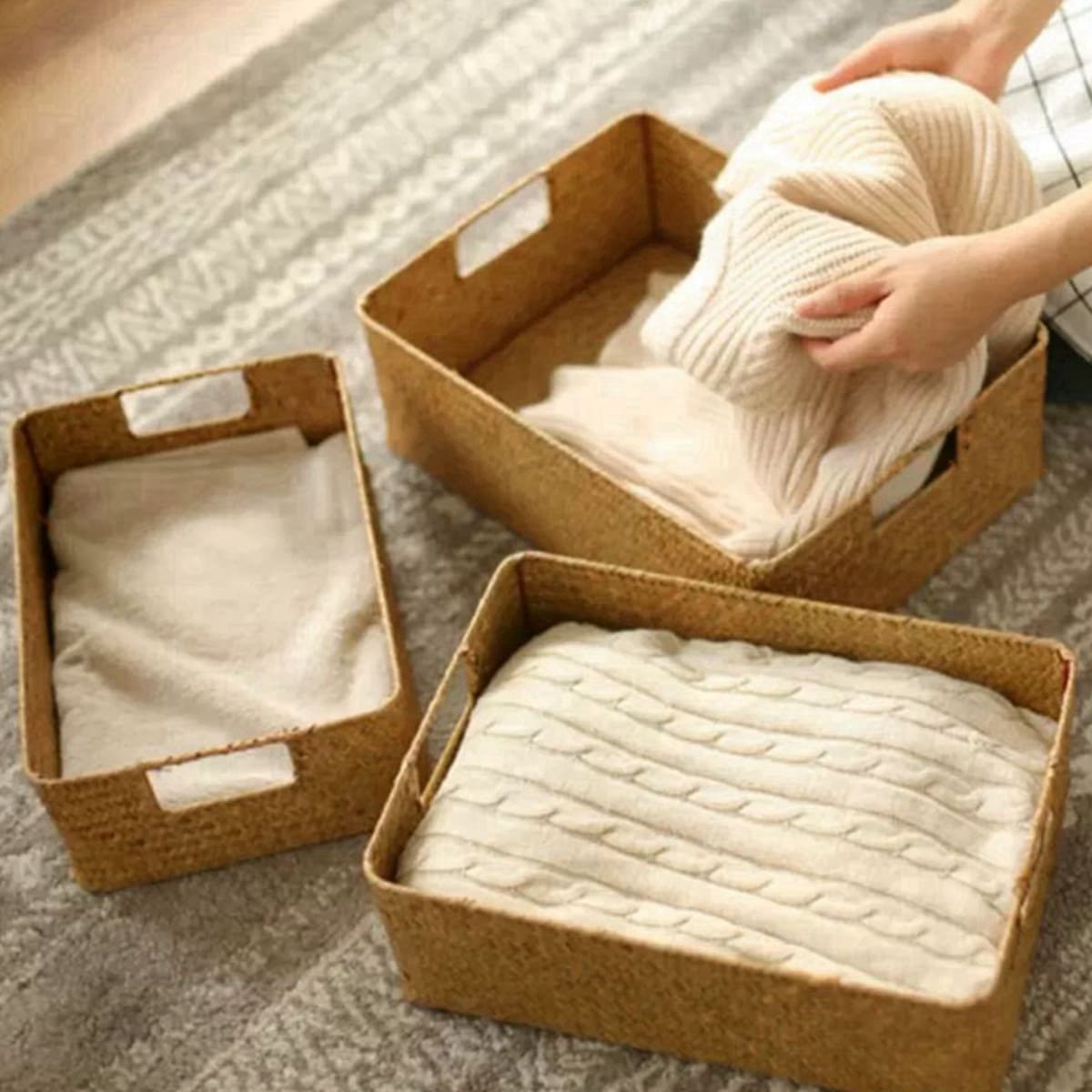 Natural fiber woven storage basket with sturdy handles – shown in a room setting (4)