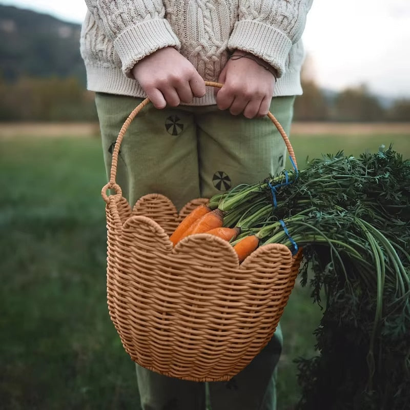 Nordic bamboo storage basket with a braided rope handle in a warm sand tone – shown in use