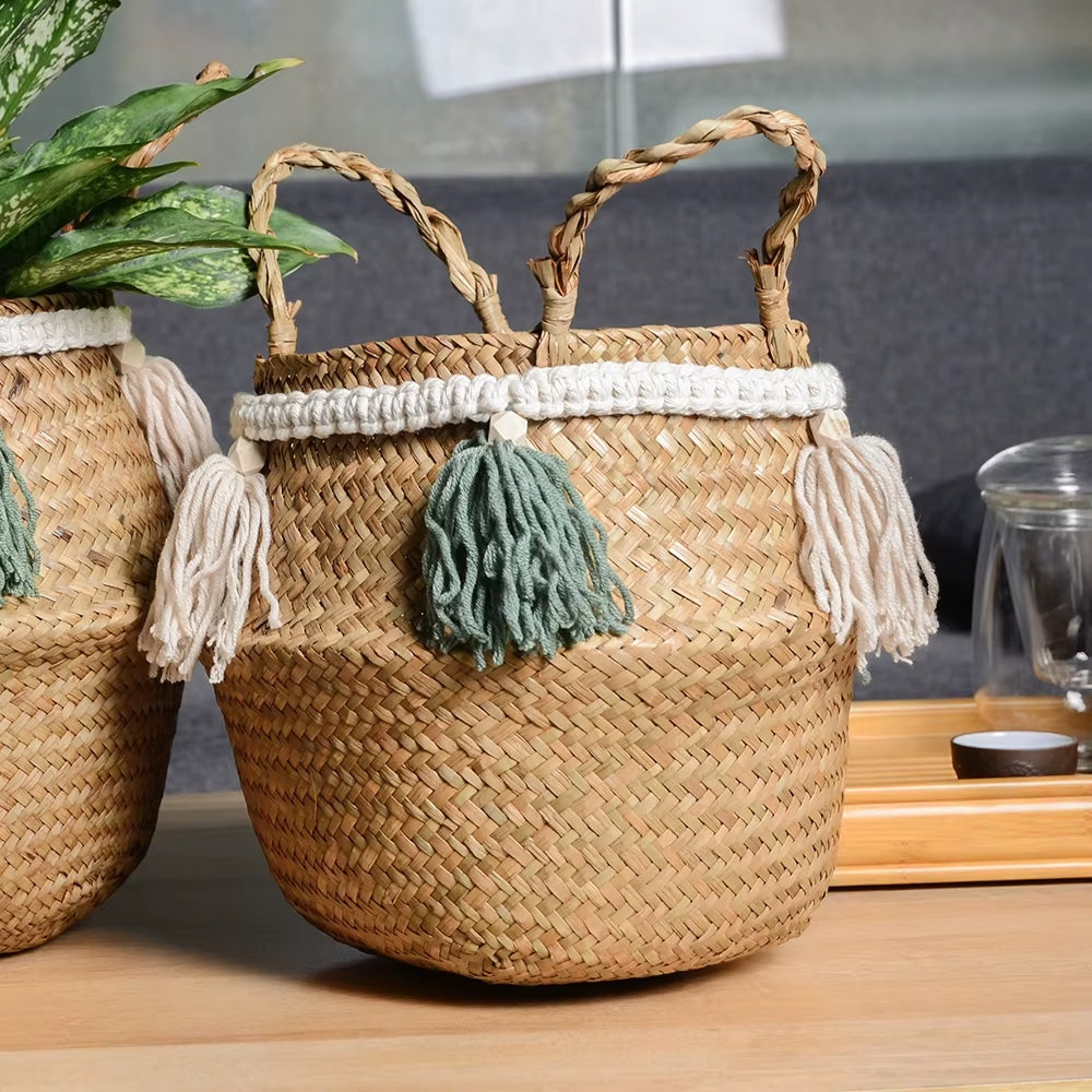 Beige rattan basket with white and green hand-knotted tassels – shown in a room setting (2)