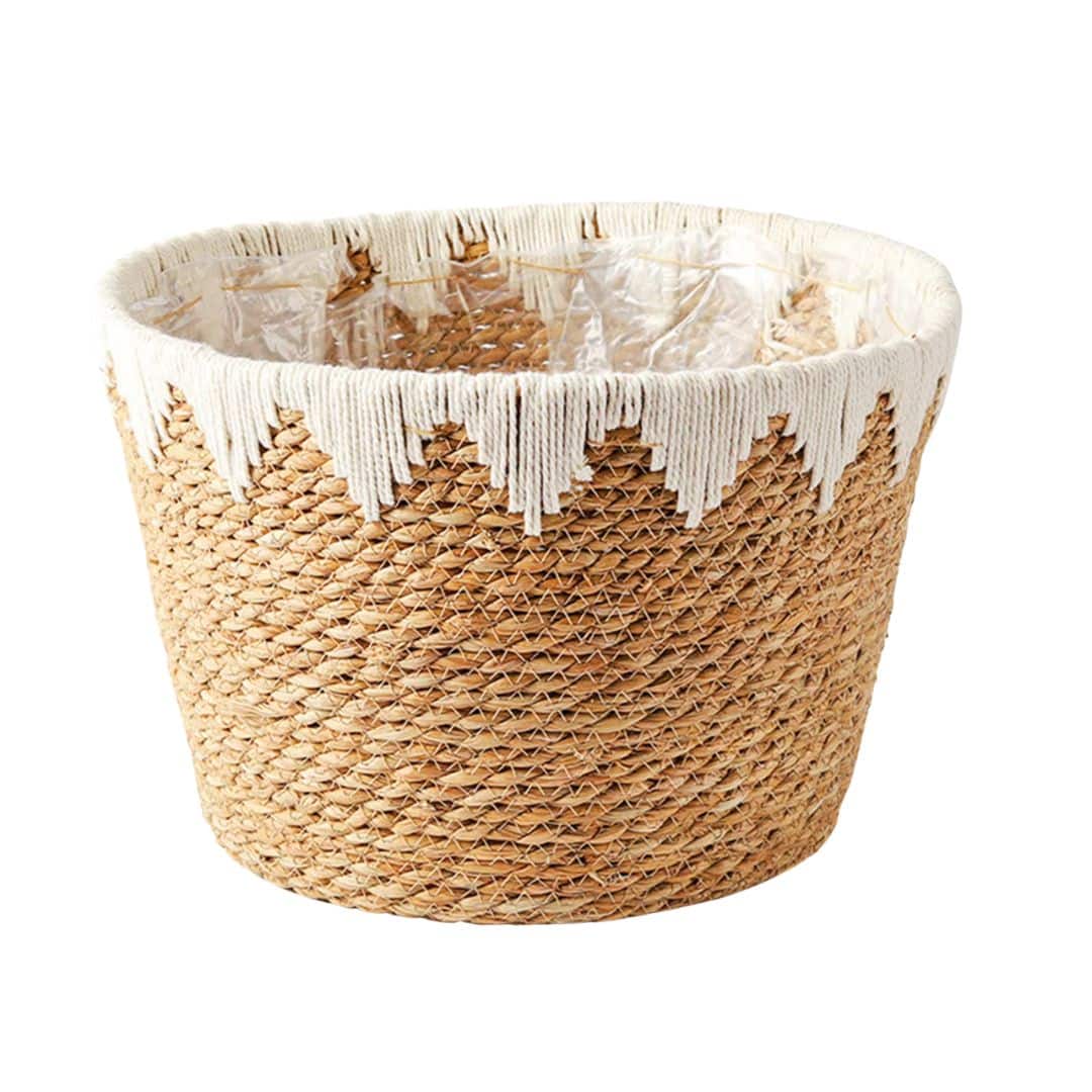 Round handwoven rattan basket with a white geometric pattern