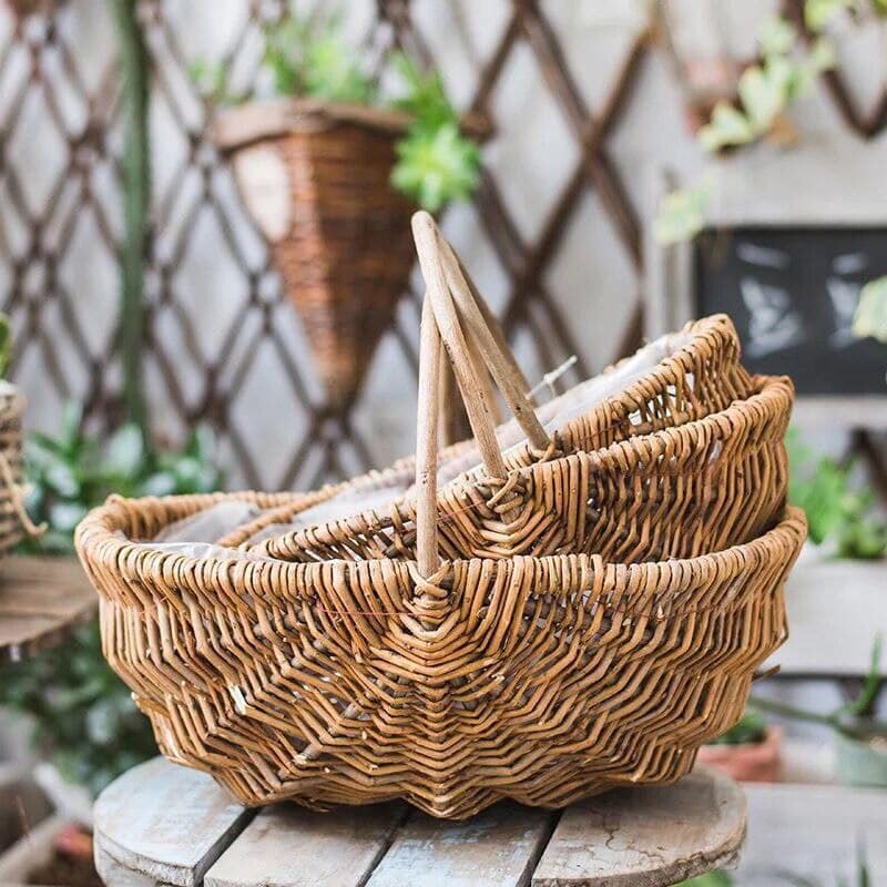 Round woven catchall basket with golden highlights – shown in a room setting (2)