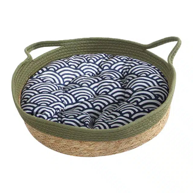 Green rattan dog bed with a plush cushion