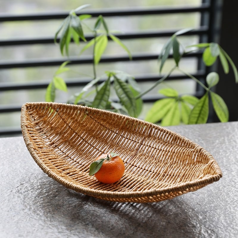 Open woven natural rattan produce basket – shown in a room setting