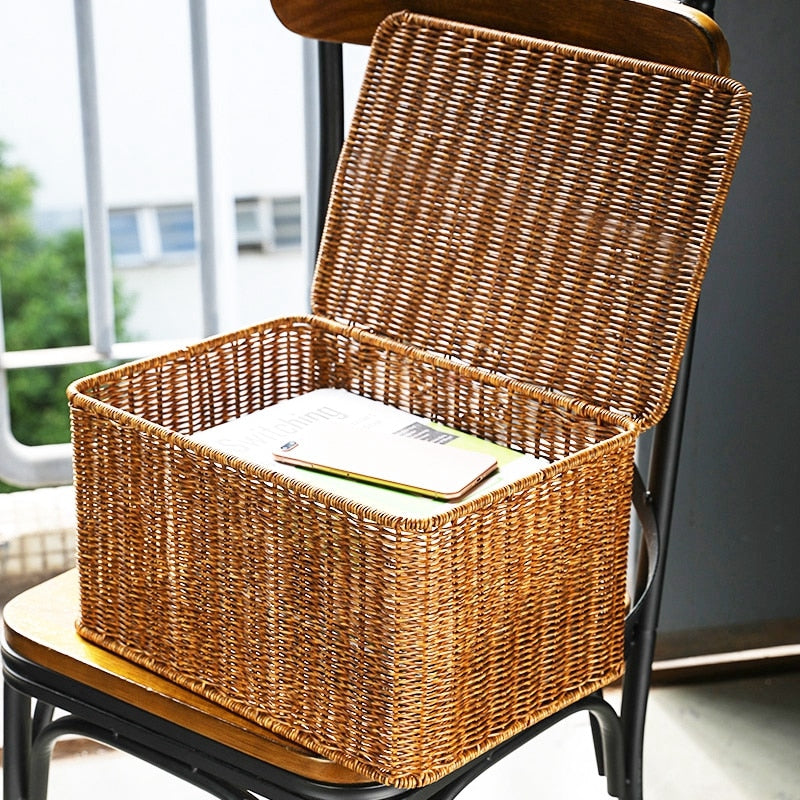 Large handwoven storage basket with a fitted lid – shown in a room setting