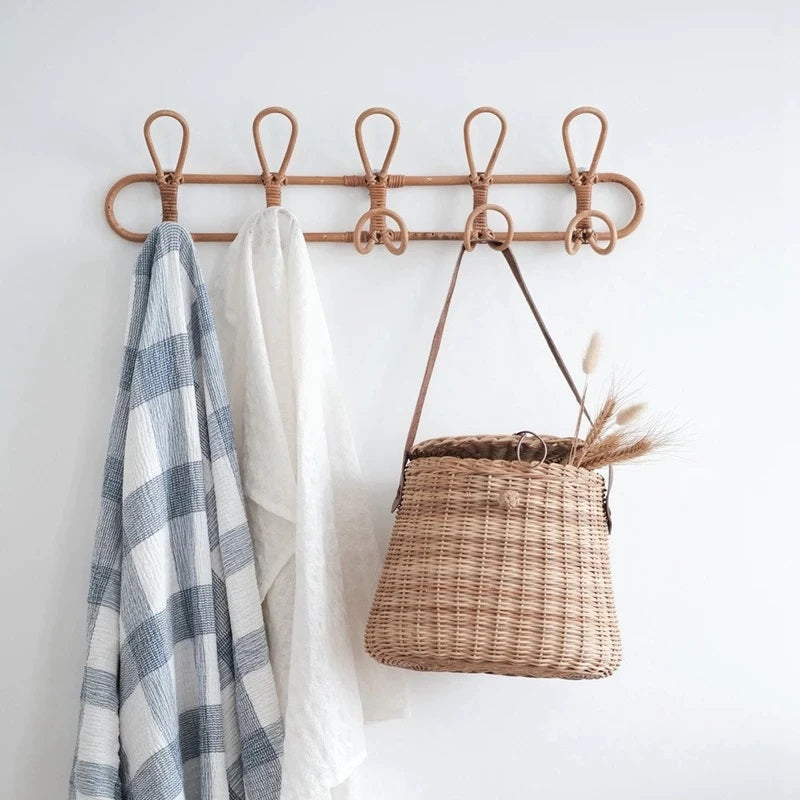 Natural rattan round wall rack with five hooks – shown in a room setting