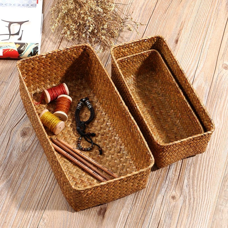 Small rectangular rattan storage basket with neatly worked edges – shown in a room setting (3)