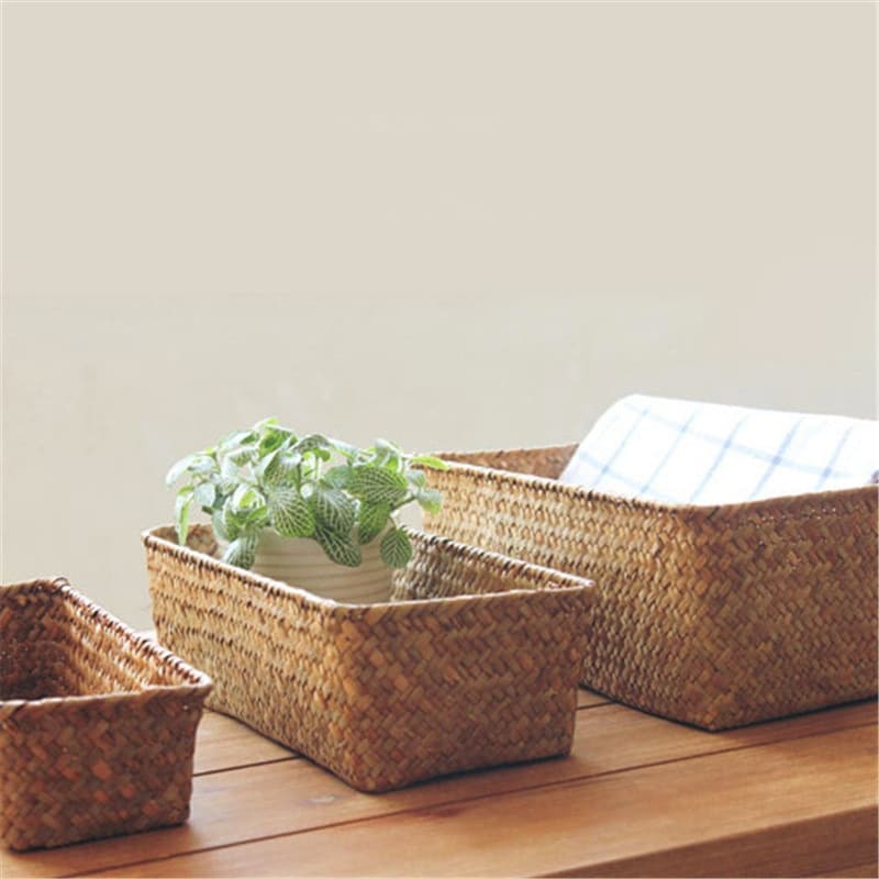 Small rectangular rattan storage basket with neatly worked edges – shown in a room setting (4)