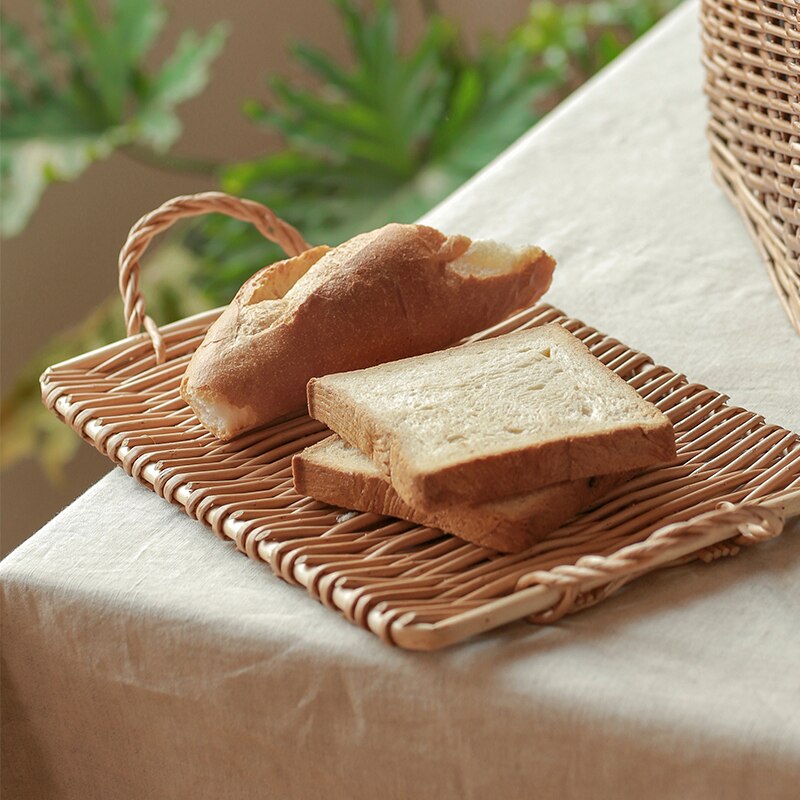 Small slim rectangular rattan tray – shown in a room setting (4)