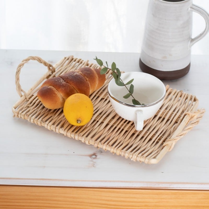Small slim rectangular rattan tray – shown in a room setting