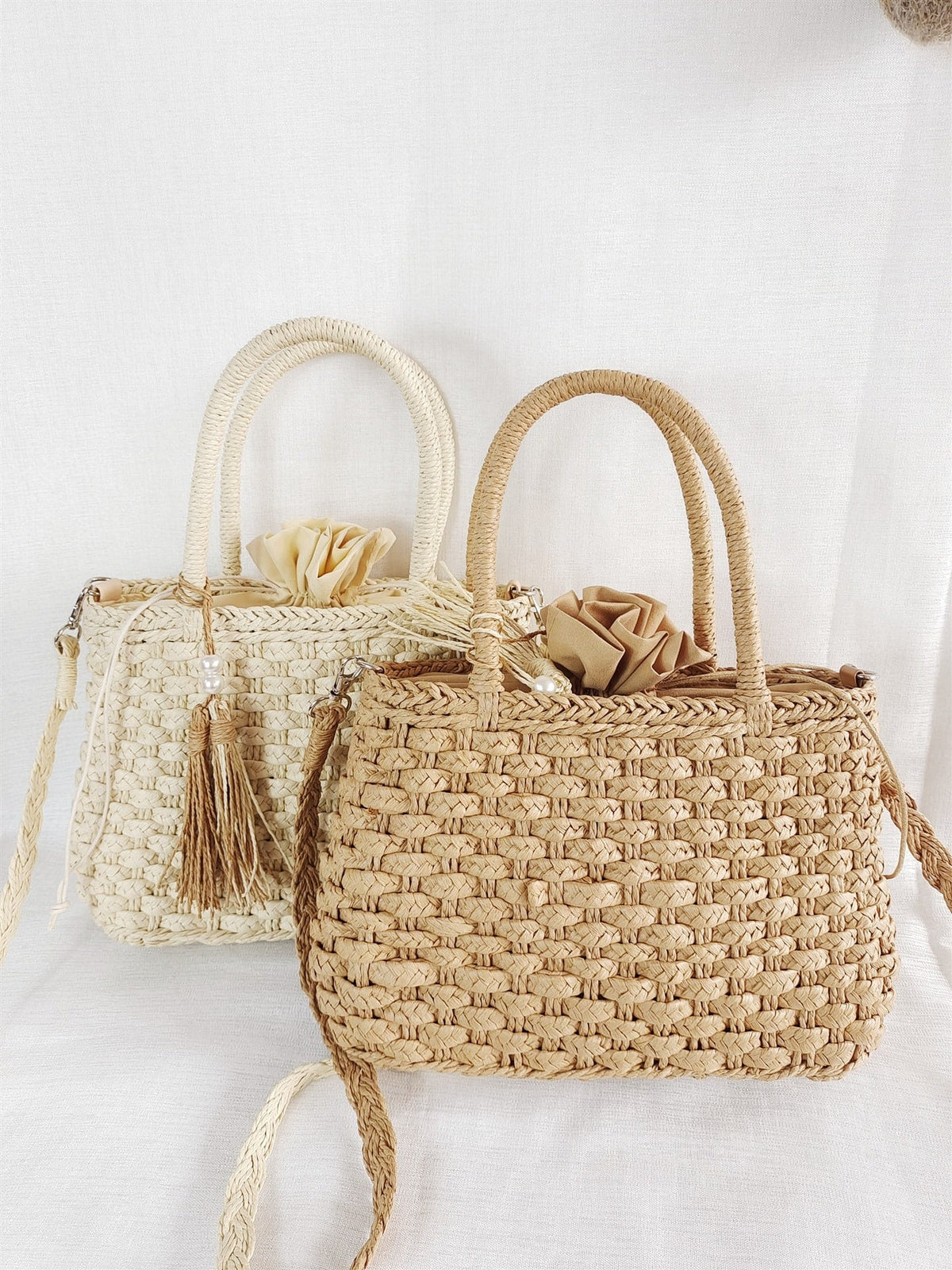 Small rattan handbag with rigid handles and a removable strap