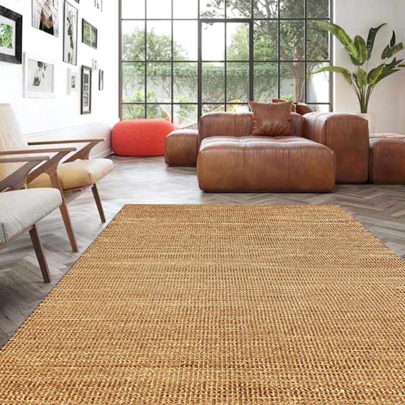 Small rectangular rattan rug with a tight weave – shown in a room setting (2)
