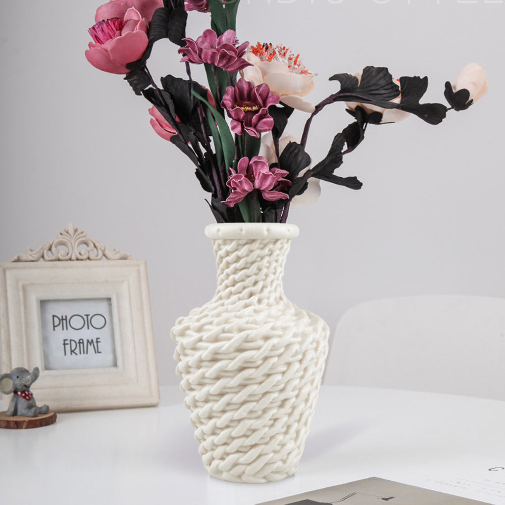 Small modern hand-braided rattan vase – white version, shown in a room setting