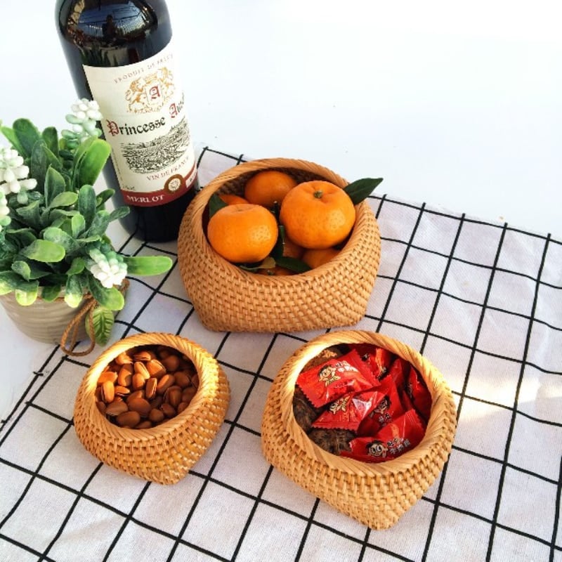 Small openwork natural rattan storage box – shown in a room setting (2)