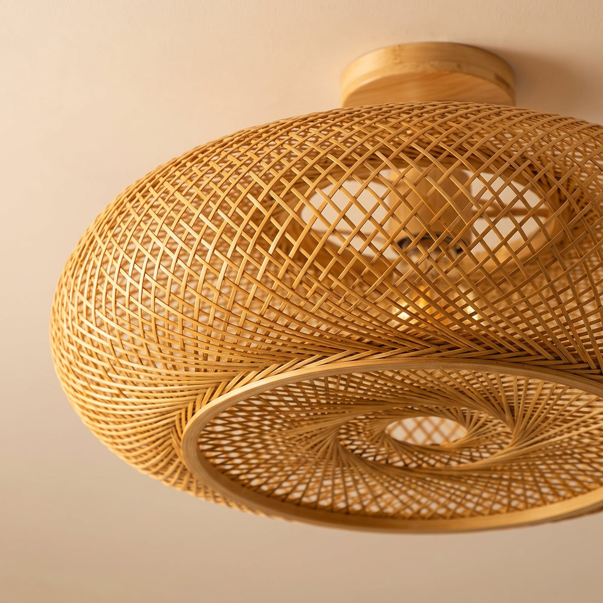 Large flat woven bamboo lantern ceiling light – close-up detail