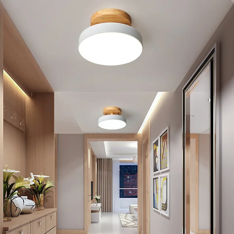 Nordic natural wood ring LED ceiling light with fine metal structure – shown lit in a room setting