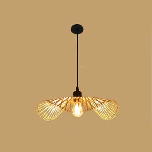 Balinese-style handwoven rattan ceiling light with a rounded silhouette – shown lit