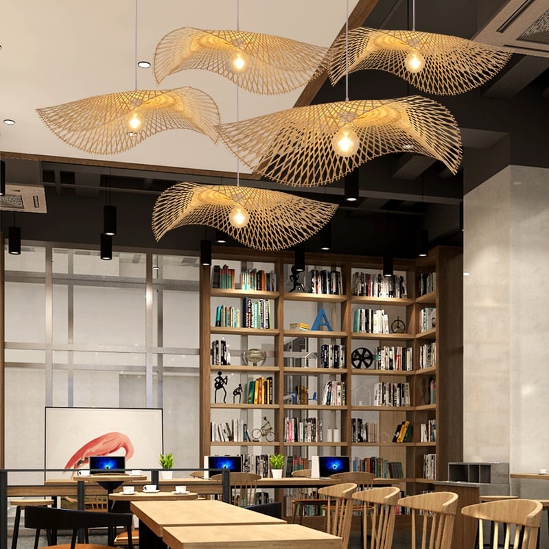Balinese-style handwoven rattan ceiling light with a rounded silhouette – shown in a room setting