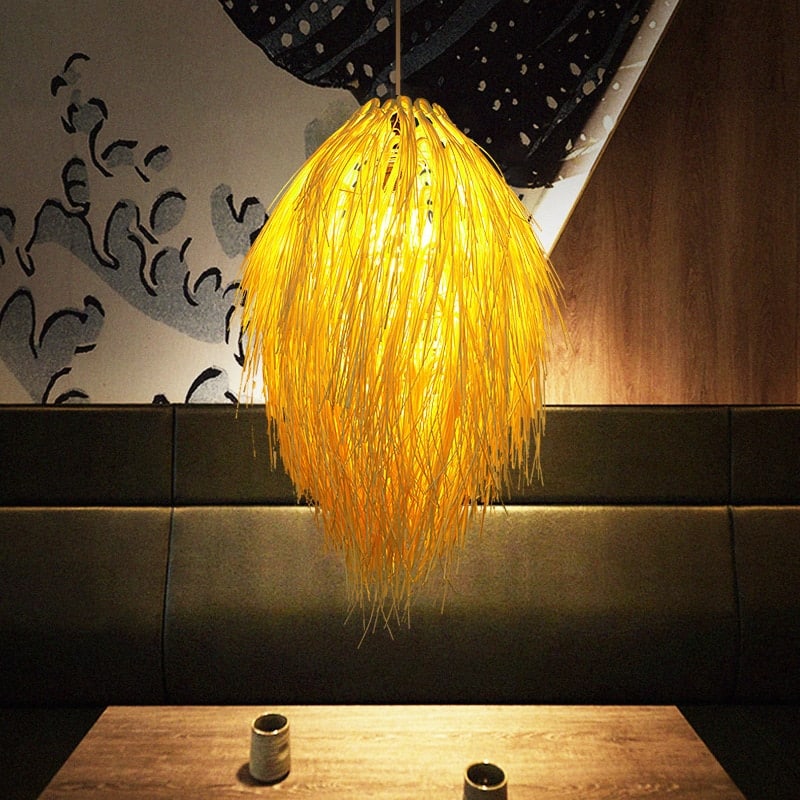 Japanese pastoral openwork rattan LED ceiling light – shown lit in a room setting