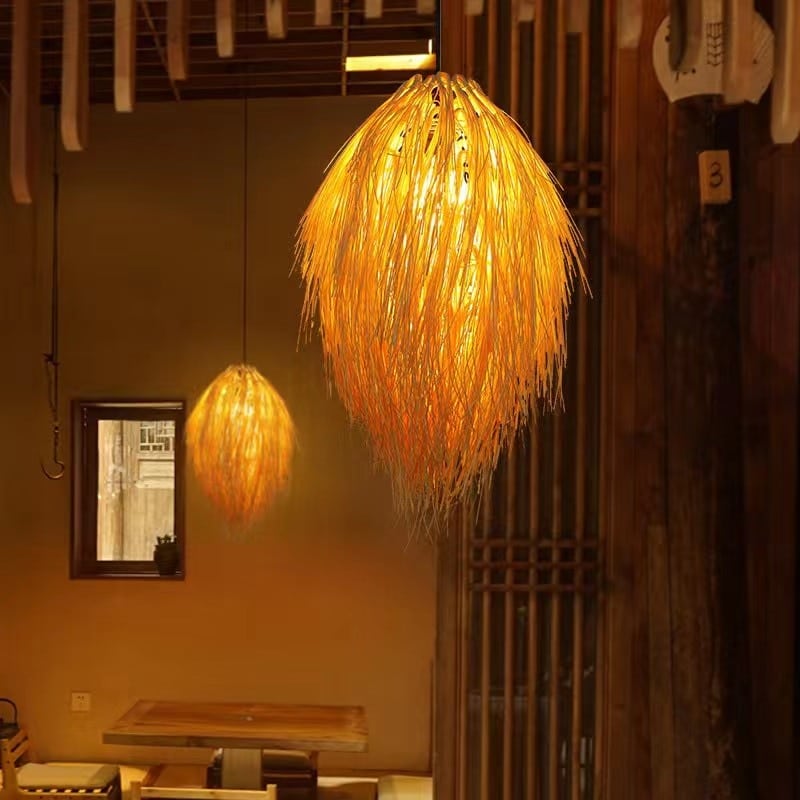 Japanese pastoral openwork rattan LED ceiling light – shown lit in a room setting (2)