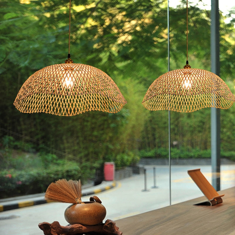 Modern geometric handwoven rattan, wicker and bamboo ceiling light – shown lit in a room setting (4)