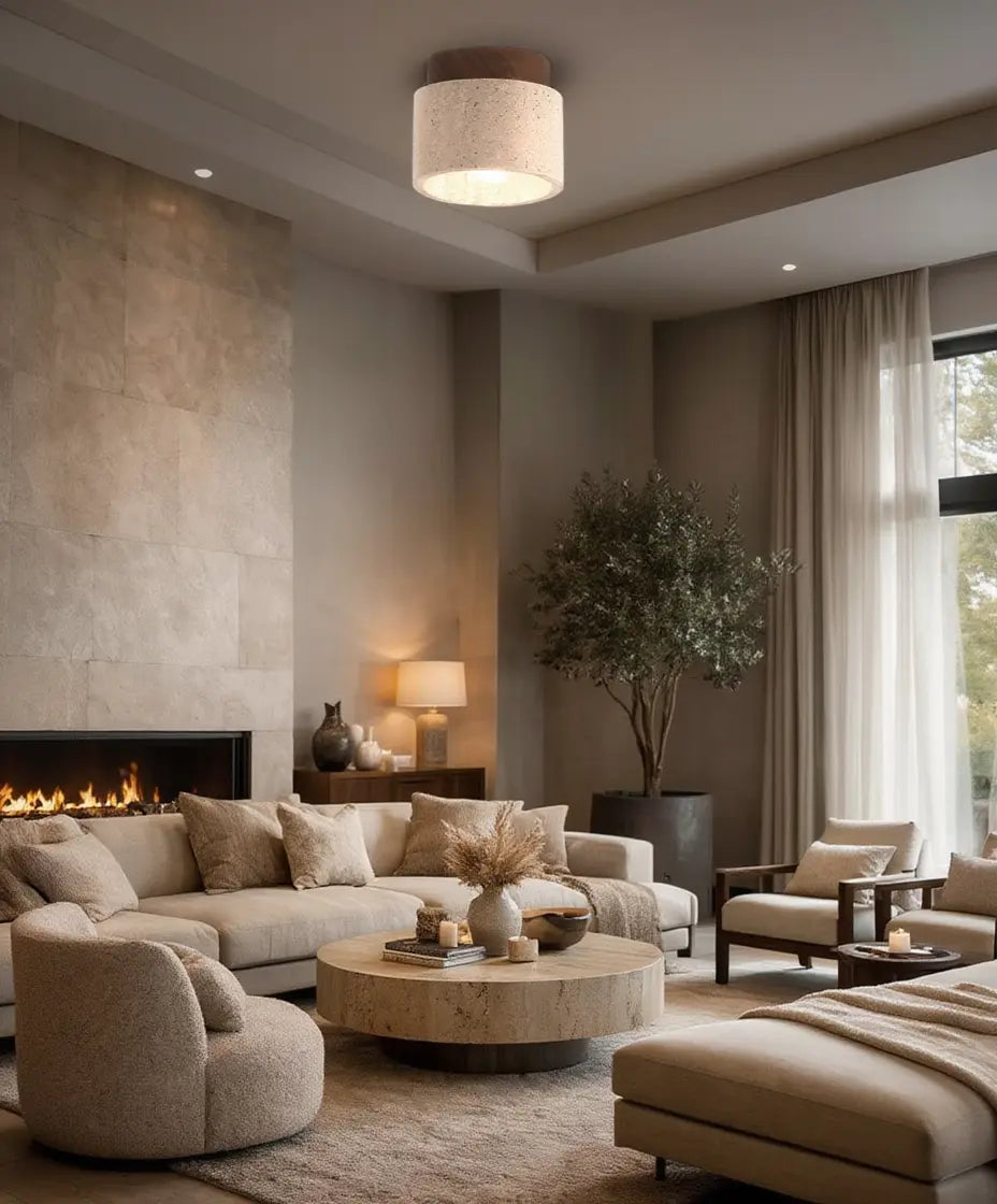 Otium travertine cylinder flush mount light with a wood crown – shown in a living room (3)